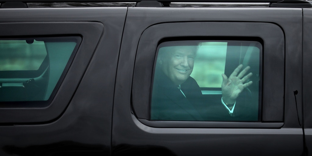BETHESDA, MD - JANUARY 12:  (AFP OUT) U.S. President Donald Trump waves to journalists as he leaves Walter Reed National Military Medical Center following his annual physical examination January 12, 2018 in Bethesda, Maryland. Trump will next travel to Florida to spend the Dr. Martin Luther King Jr. Day holiday weekend at his Mar-a-Lago resort.  (Photo by Chip Somodevilla/Getty Images)