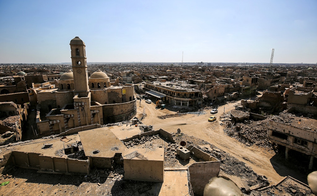 A picture taken on March 14, 2018 shows a view of destruction surrounding the Roman Catholic Church of Our Lady of the Hour (L) in the old city of Mosul, eight months after it was retaken by Iraqi government forces from the control of Islamic State (IS) group fighters. / AFP PHOTO / AHMAD AL-RUBAYE        (Photo credit should read AHMAD AL-RUBAYE/AFP/Getty Images)