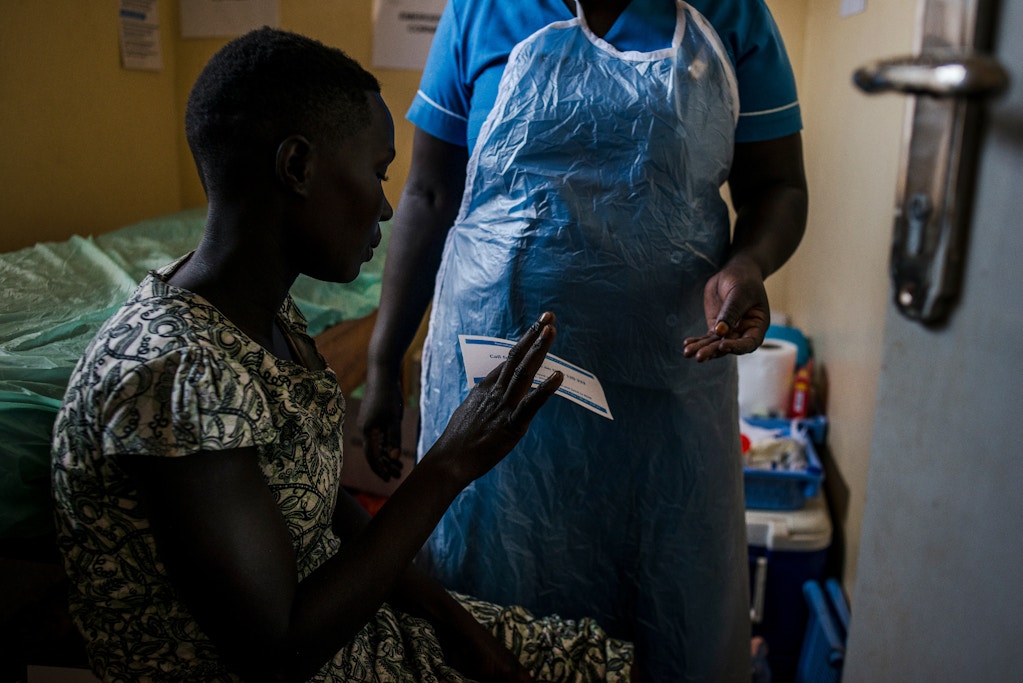 Brenda gets follow up paperwork after receiving her IUD on March 26, 2018 in Parabongo, Uganda.