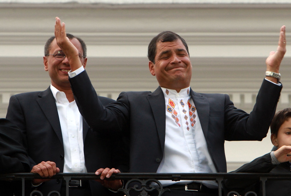 Ecuador's President and candidate for re-election Rafael Correa, top right, and vice presidential candidate Jorge Glass, top left, accompanied by relatives, celebrate after presidential elections in Quito, Ecuador, Sunday, Feb. 17, 2013. Although official results had still not been released, Correa celebrated his second re-election as Ecuador's president after an exit poll showed him leading by a wide margin. (AP Photo/Martin Jaramillo)