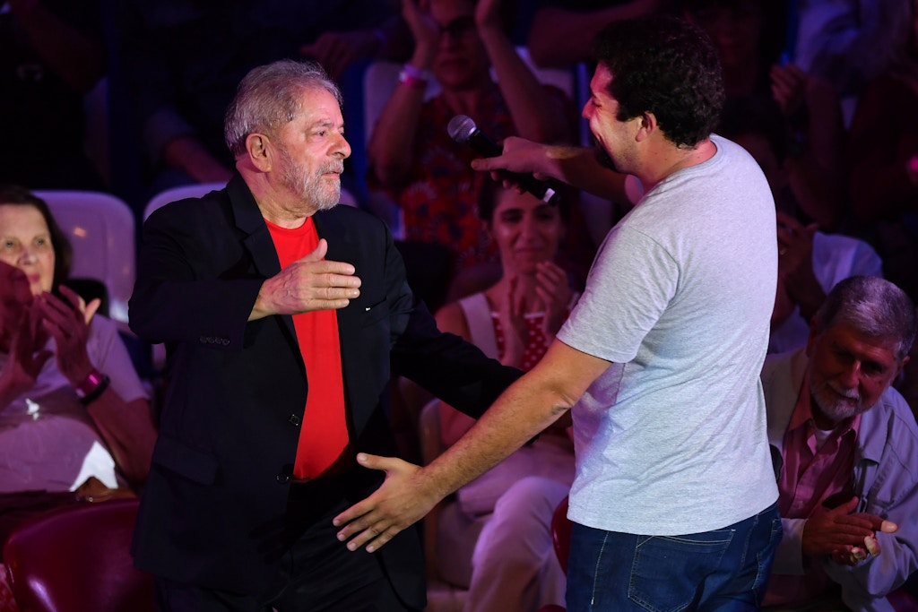 Former Brazilian president Luiz Inacio Lula da Silva (L) greets a coordinator of the Brazilian Homeless Workers Movement (MTST) Guilherme Boulos (R) during a meeting with intellectuals in Sao Paulo, Brazil on January 18, 2018. / AFP PHOTO / NELSON ALMEIDA        (Photo credit should read NELSON ALMEIDA/AFP/Getty Images)