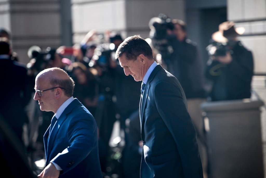 Gen. Michael Flynn(R), former national security adviser to US President Donald Trump, leaves Federal Court on December 1, 2017 in Washington, DC.Donald Trump's former top advisor Michael Flynn pleaded guilty Friday to lying over his contacts with Russia, in a dramatic escalation of the FBI's probe into possible collusion between the Trump campaign and Moscow. The fourth, and most senior, figure indicted so far in the investigation into Russian interference in last year's election, Flynn appeared in federal court in Washington for a plea hearing less than two hours after the charges against him were made public.Ex-Trump aide Flynn says he recognizes his actions 'were wrong'. / AFP PHOTO / Brendan Smialowski (Photo credit should read BRENDAN SMIALOWSKI/AFP/Getty Images)