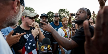 Isaiah Moore, right, argues with counter demonstrators about race relations during a rally in Coolidge Park on Thursday, Aug. 17, 2017, in Chattanooga, Tenn. Organizers said that the purpose of the demonstration, held in response to Saturday's rally by white nationalists in Charlottesville, Va., was to declare resistance against Nazism. (Doug Strickland/Chattanooga Times Free Press via AP)
