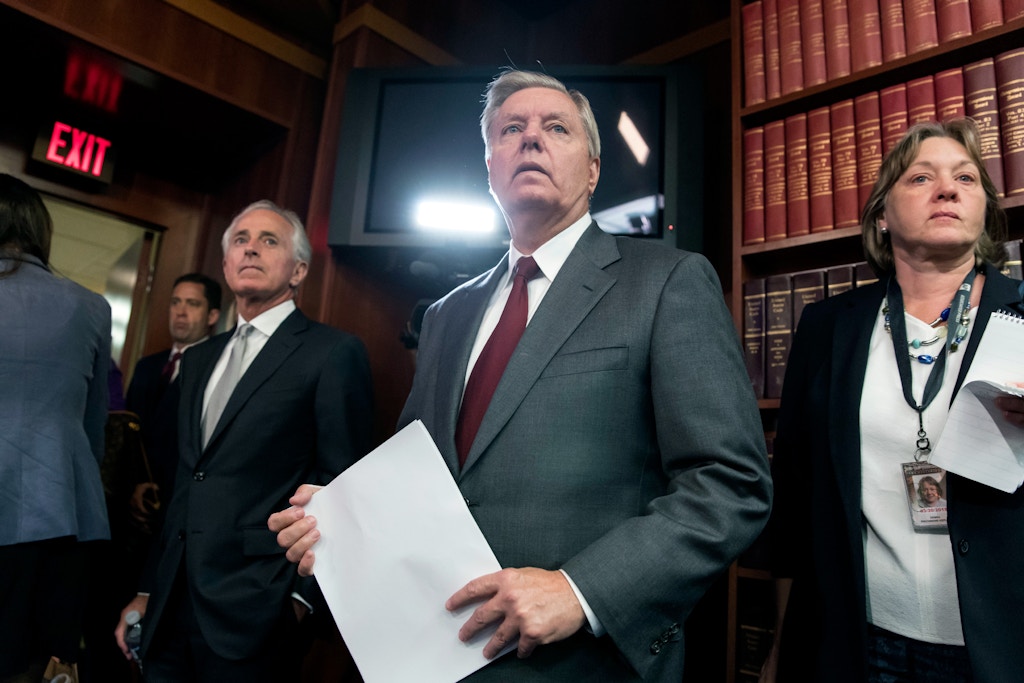 Sen. Lindsey Graham, R-S.C., joined by the Senate Foreign Relations Committee Chairman Sen. Bob Corker, R-Tenn., left, prepares to speak with reporters on Capitol Hill in Washington, Thursday, Aug. 3, 2017, after the "Taylor Force Act" was approved in committee. The bill suspends U.S. financial aid to the Palestinian Authority until it stops rewarding Palestinians who kill American and Israeli citizens and was named for Taylor Force, a West Point graduate from Texas who was visiting Israel in 2016 when he was stabbed to death by a Palestinian. (AP Photo/J. Scott Applewhite)