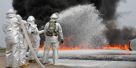 Marines with Bulk Fuel Company, 8th Engineer Support Battalion, 2nd Marine Logistics Group use Twin Agent Units to extinguish a blaze during a live fire training exercise aboard Marine Corps Air Station Cherry Point, Aug. 28, 2013. TAUs combine dry chemicals with water to create a foam that chokes the oxygen from a fire, stunting its growth and effectively ending it. (U.S. Marine Corps photo by Lance Cpl. Shawn Valosin)
