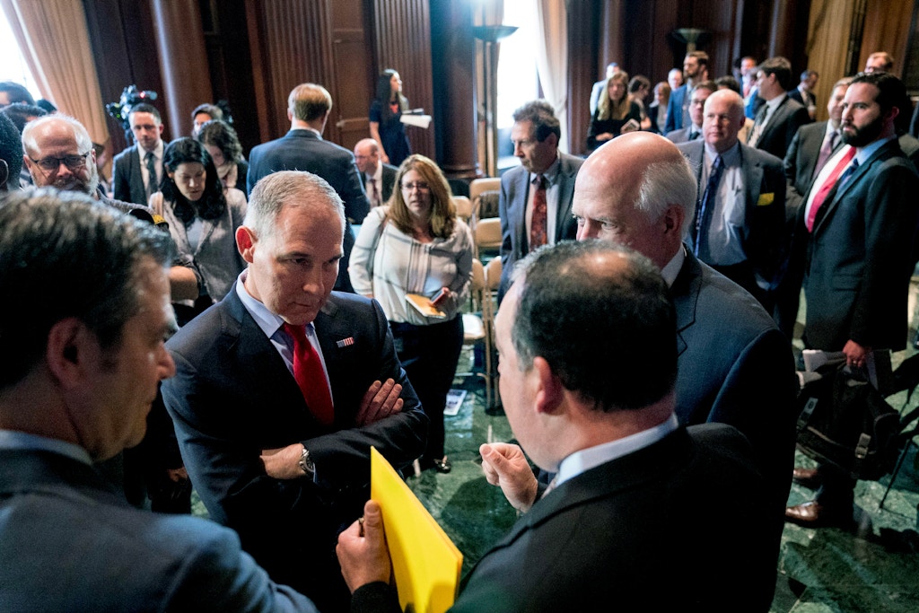 Environmental Protection Agency Administrator Scott Pruitt, second from left, speaks with auto industry leaders following a news conference at the Environmental Protection Agency in Washington, Tuesday, April 3, 2018, on his decision to scrap Obama administration fuel standards. (AP Photo/Andrew Harnik)