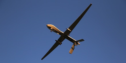 A U.S. Air Force MQ-1B Predator unmanned aerial vehicle (UAV), carrying a Hellfire missile flies over an air base after flying a mission in the Persian Gulf region on January 7, 2016. The U.S. military and coalition forces use the base, located in an undisclosed location, to launch airstrikes against ISIL in Iraq and Syria, as well as to distribute cargo and transport troops supporting Operation Inherent Resolve. The Predators at the base are operated and maintained by the 46th Expeditionary Reconnaissance Squadron, currently attached to the 386th Air Expeditionary Wing. (Photo by John Moore/Getty Images)