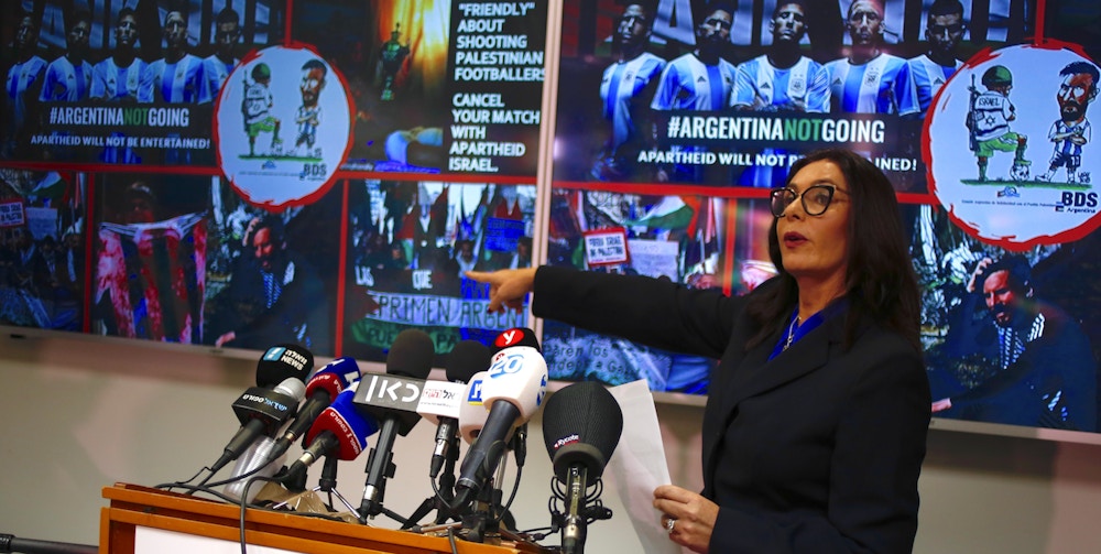 Israeli Sports and Culture Minister Miri Regev delivers a statement in Tel Aviv, Israel, Wednesday, June 6, 2018. Argentina has called off a World Cup warmup match against Israel following protests by pro-Palestinian groups. (AP Photo/Ariel Schalit)