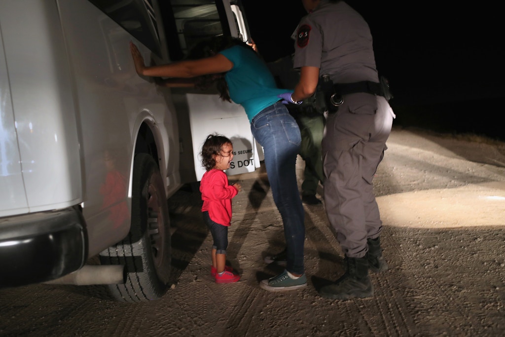 MCALLEN, TX - JUNE 12:  A two-year-old Honduran asylum seeker cries as her mother is searched and detained near the U.S.-Mexico border on June 12, 2018 in McAllen, Texas. The asylum seekers had rafted across the Rio Grande from Mexico and were detained by U.S. Border Patrol agents before being sent to a processing center for possible separation. Customs and Border Protection (CBP) is executing the Trump administration's zero tolerance policy towards undocumented immigrants. U.S. Attorney General Jeff Sessions also said that domestic and gang violence in immigrants' country of origin would no longer qualify them for political asylum status.  (Photo by John Moore/Getty Images)