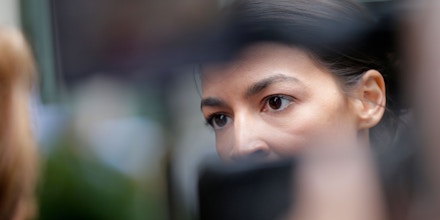 Alexandria Ocasio-Cortez does an interview near Rockefeller Center in New York, Wednesday, June 27, 2018. The 28-year-old political newcomer who upset U.S. Rep. Joe Crowley in New York's Democrat primary says she brings an 