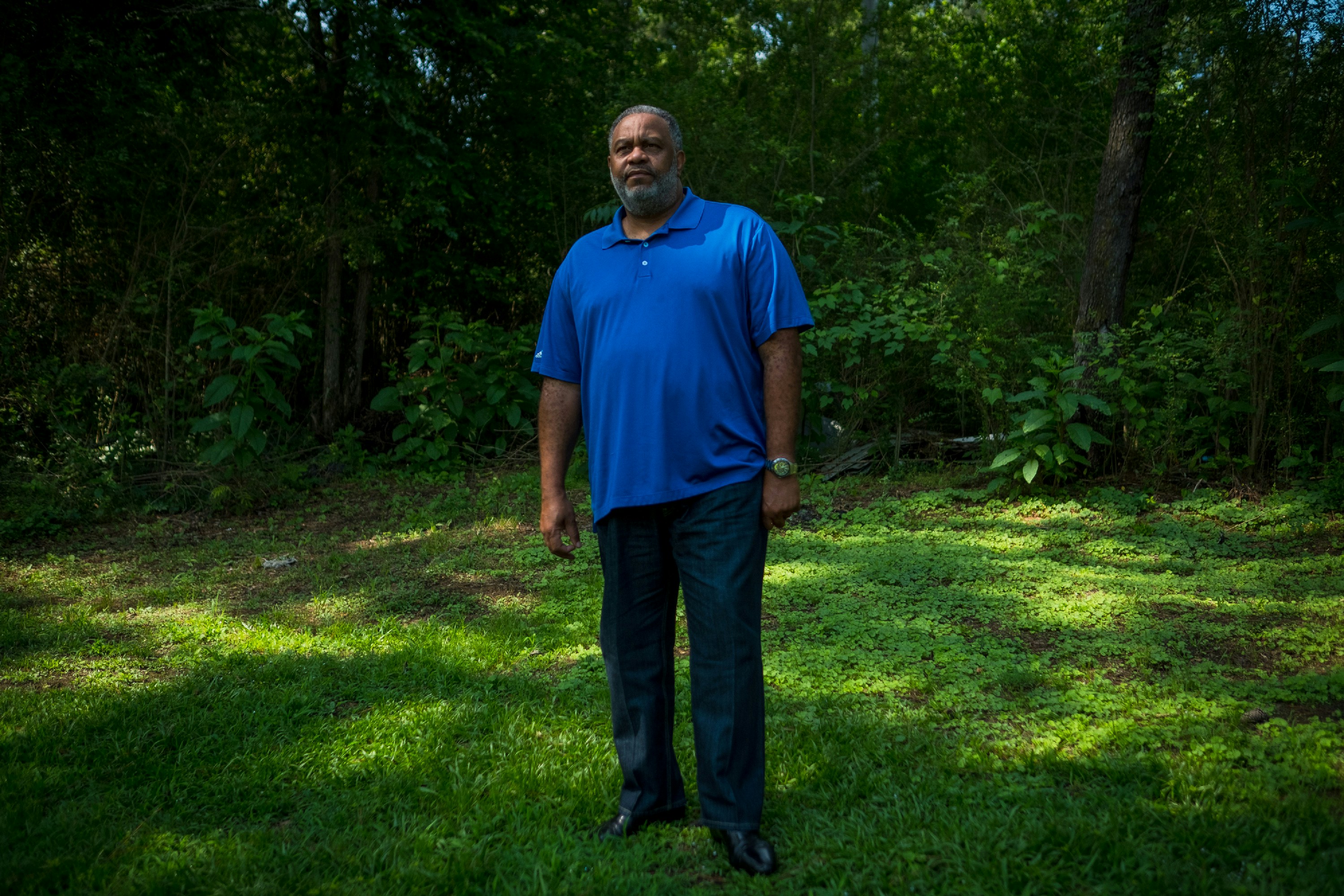 Anthony Ray Hinton stands near the spot in the yard of his home in Quinton, Alabama, Sunday, June 3, 2018, where Alabama police officers came to arrest him for crimes he didn't commit in 1985. When he is not traveling, Hinton says he spends a lot of time outdoors. "It just gives me a sense of belonging. When one has been locked up, the last place I want to be is stuck in the house. I love the outdoors." Hinton spent 30 years on death row after he was wrongfully incarcerated for two murders he did not commit. His recently released his memoir, "The Sun Does Shine: How I Found Life and Freedom on Death Row.”<br /> (Tamika Moore for The Intercept)