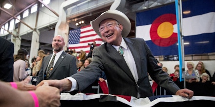 Former Senator and Secretary of the Interior Ken Salazar, D-Colo., greets members of the audience during a rally for Democratic presidential candidate Hillary Clinton at the Colorado State Fairgrounds in Pueblo, Colo., Wednesday, Oct. 12, 2016. (AP Photo/Andrew Harnik)