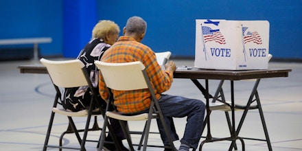 DURHAM, N.C - NOVEMBER 8:  An elderly couple reads a ballot prior to voting on November 8, 2016 in Durham, North Carolina.  African American turn out to the polls was reporting low across the battleground state. (Photo by Sara D. Davis/Getty Images)