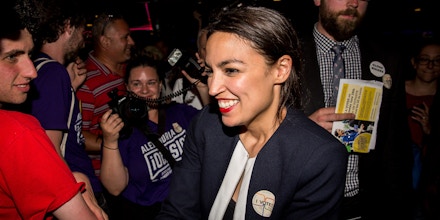 NEW YORK, NY - JUNE 26: Progressive challenger Alexandria Ocasio-Cortez celebrartes with supporters at a victory party in the Bronx after upsetting incumbent Democratic Representative Joseph Crowly on June 26, 2018 in New York City.  Ocasio-Cortez upset Rep. Joseph Crowley in New York’s 14th Congressional District, which includes parts of the Bronx and Queens. (Photo by Scott Heins/Getty Images)