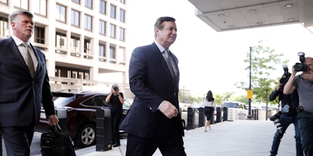 Paul Manafort, former campaign manager for Donald Trump, right, and attorney Kevin Downing arrive at federal court in Washington, D.C., U.S., on Wednesday, May 23, 2018. Lawyers for Manafort accused prosecutors working with Special Counsel Robert Mueller of smearing their client through unflattering media accounts that originated with illegal grand jury leaks. Photographer: Aaron P. Bernstein/Bloomberg via Getty Images