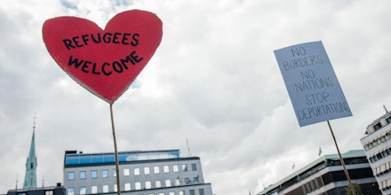 A sign reading 'refugees welcome' is pictured during a demonstration in solidarity with migrants seeking asylum in Europe after fleeing their home countries in Stockholm on September 12, 2015. AFP PHOTO/JONATHAN NACKSTRAND        (Photo credit should read JONATHAN NACKSTRAND/AFP/Getty Images)