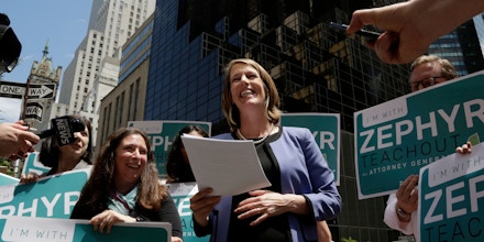 Zephyr Teachout announces her Democratic Party candidacy for the New York State Attorney General while standing across from Trump Tower, Tuesday, June 5, 2018, in New York. She also announced to the media that she is pregnant. (AP Photo/Mark Lennihan)