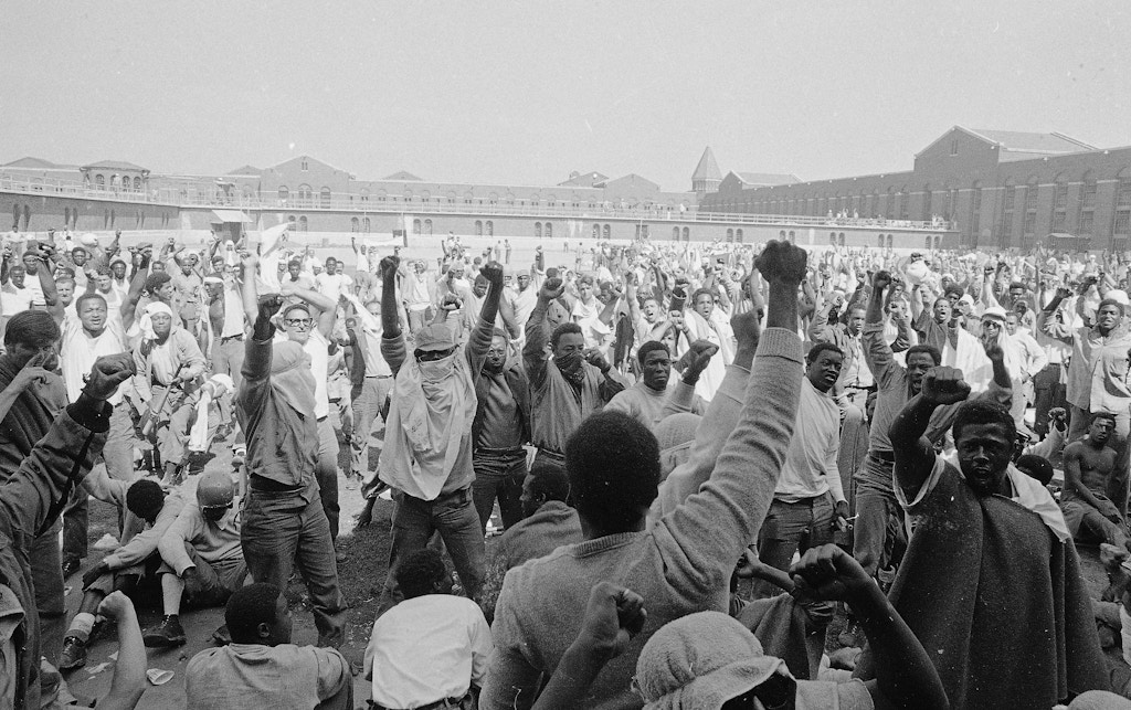 Inmates at Attica State Prison in Attica, N.Y., raise their hands in clenched fists in a show of unity, Sept. 1971, during the Attica uprising, which took the lives of 43 people.  (AP Photo)