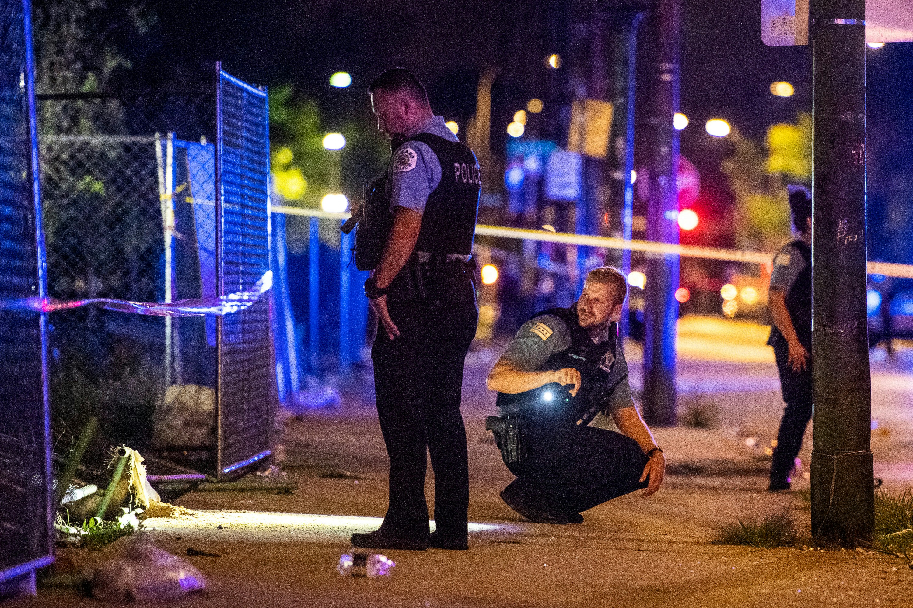 In this Aug. 5, 2018 photo, police investigate the scene where multiple people were shot in Chicago. Police Superintendent Eddie Johnson plans to discuss the violence during a Monday news conference. (Tyler LaRiviere/Chicago Sun-Times via AP)