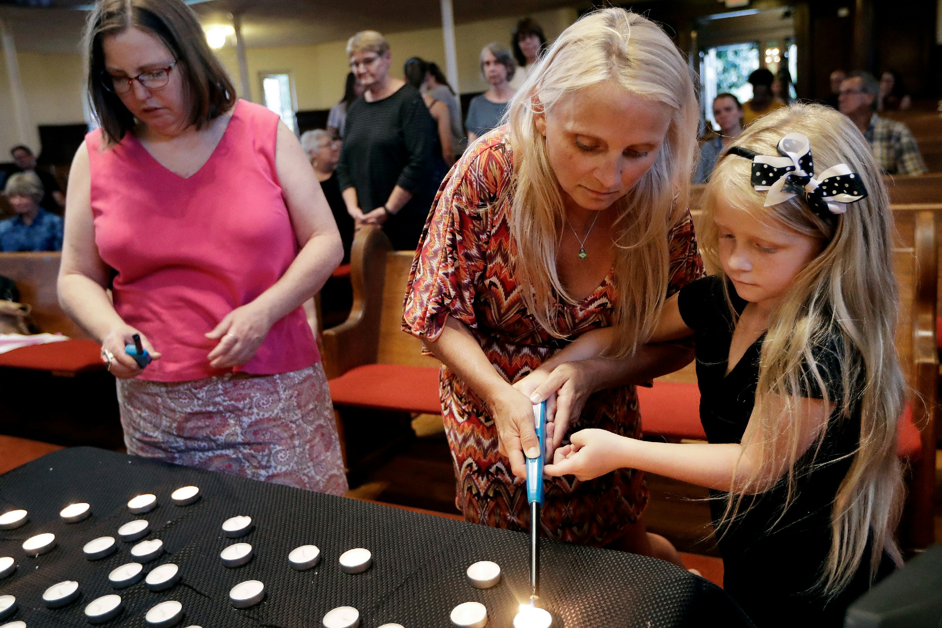 Candles are lit during a vigil at Fisk University to protest the execution of Billy Ray Irick Thursday, Aug. 9, 2018, in Nashville, Tenn. Tennessee carried out the execution of Irick, condemned for the 1985 rape and murder of a 7-year-old girl, marking the first time the state has applied the death penalty since 2009. (AP Photo/Mark Humphrey)