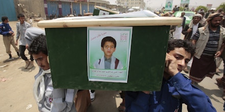 Yemeni people carry the coffin of a boy who was killed by a Saudi-led airstrike, during a funeral in Saada, Yemen, Monday, Aug. 13, 2018. Yemen's shiite rebels are backing a United Nations' call for an investigation into the airstrike in the country's north that killed dozens of people including many children. (AP Photo/Hani Mohammed)