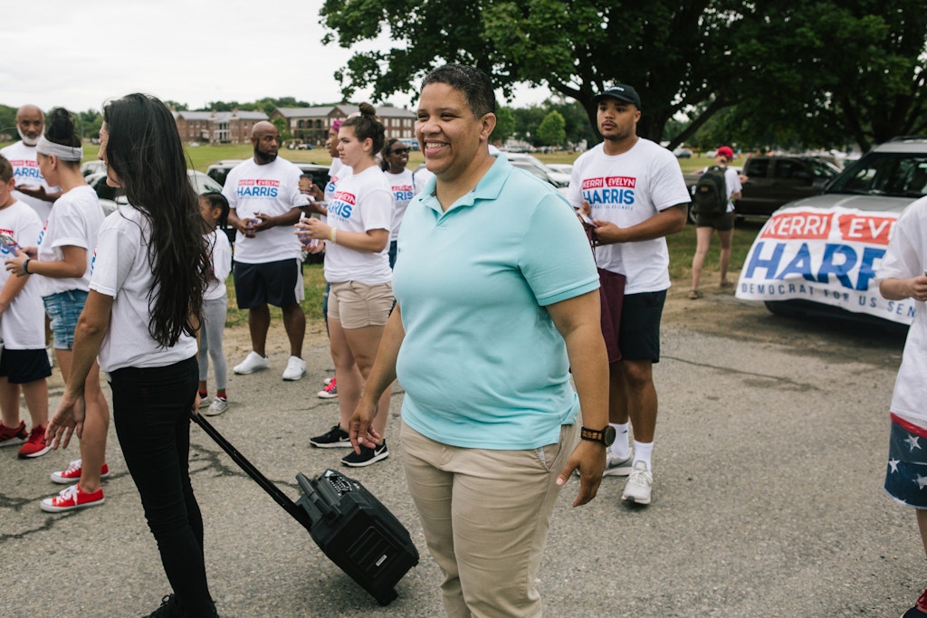 Kerri Evelyn Harris, Democratic candidate for the United States Senate from Delaware, prepares to walk in a parade celebrating Delaware City Day in Delaware City, Delaware on Saturday, July 21, 2018. Harris, a former community organizer and Air Force veteran, is campaigning on issues such as Medicare-For-All, environmental justice, higher minimum wage, expanding LGBTQ rights, and pre-K for all. (Michelle Gustafson for The Intercept)
