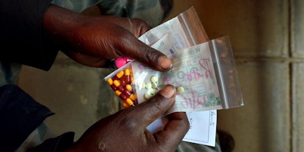 A man suffering from tuberculosis (TB) holds his medication after receiving it at a Medecins Sans Frontieres (MSF)-run clinic in Nairobi on March 24, 2015, World Tubeclosis Day. Globally, TB continues to kill 1.5 to 2 million people each year and remains the leading cause of death in people with HIV. In 2013, there were 90,000 new cases of TB diagnosed in Kenya and an estimated 20,000 cases went undetected. AFP PHOTO / TONY KARUMBA        (Photo credit should read TONY KARUMBA/AFP/Getty Images)