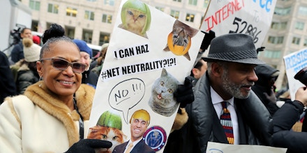 WASHINGTON, DC - DECEMBER 14:  Demonstrators rally outside the Federal Communication Commission building to protest against the end of net neutrality rules December 14, 2017 in Washington, DC. Lead by FCC Chairman Ajit Pai, the commission is expected to do away with Obama Administration rules that prevented internet service providers from creating differnt levels of service and blocking or promoting individual companies and organizations on their systems.  (Photo by Chip Somodevilla/Getty Images)