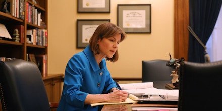 Minnesota Attorney General Lori Swanson reviews evidence in the case of President Donald Trump's immigration ban targeting seven predominantly Muslim countries in her office at the State Capitol building in St. Paul, Minn., on Friday, Feb. 10, 2017. (Anthony Souffle/Star Tribune via AP)