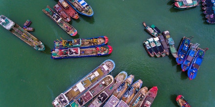 SANYA, CHINA - AUGUST 16: Fishing boats set sail from a harbor to catch fish in the South China Sea on August 16, 2017 in Sanya, Hainan Province of China. About 18,000 fishing boats set sail from Hainan to South China Sea for fishing on Wednesday. (Photo by Luo Yunfei/CHINA NEWS SERVICE/VCG via Getty Images)