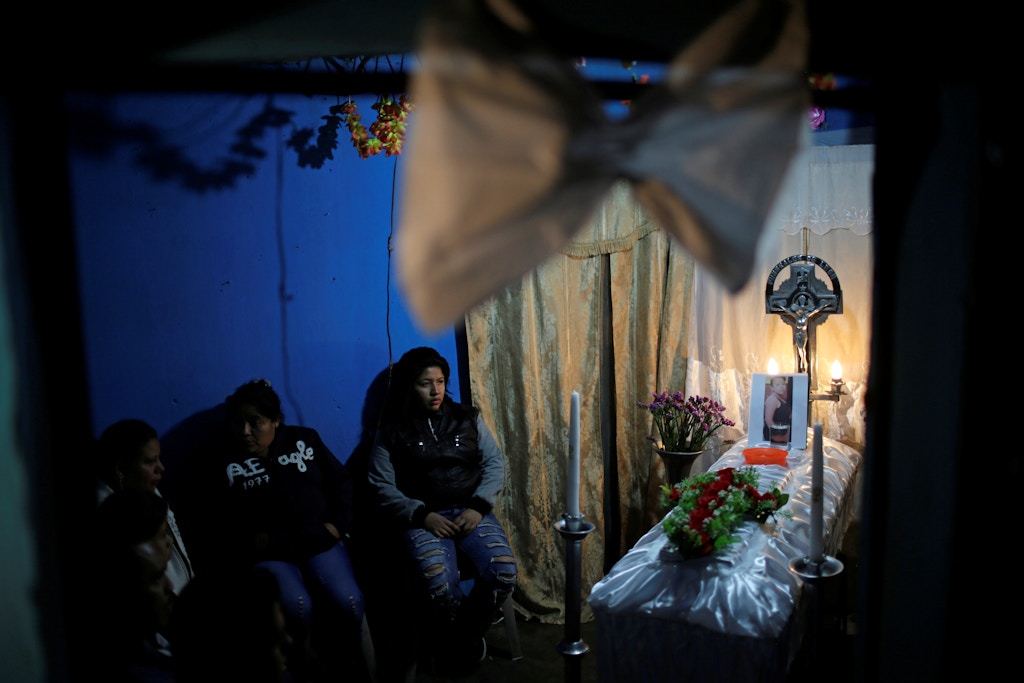 Family and friends attend the wake of Madelin Patricia Hernandez, a victim of a fire at the Virgen de Asuncion children shelter, at her grandmother's home in Guatemala City, Guatemala March 9, 2017. REUTERS/Saul Martinez - RC18CDE59090