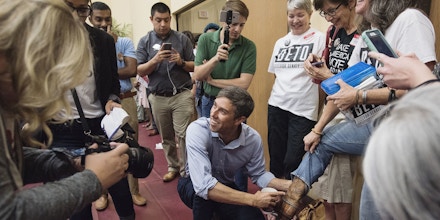 Beto O'Rourke, D-El Paso, points to his autograph on the boot of Staci Oller Smith of Tyler during his campaign stop at St. Louis Baptist Church in Tyler, Texas on Monday Aug. 13, 2018. O'Rourke signed the boot over a year ago at a campaign stop at Don Juan's Restaurant in downtown Tyler. The current U.S. Rep is running for U.S. Senate against Ted Cruz. More than 600 people attended the campaign stop. (Sarah A. Miller/Tyler Morning Telegraph via AP)