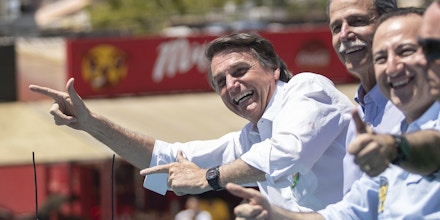 Brazilian presidential candidate for the Social Liberal Party (PSL, in Portuguese) Jair Bolsonaro greets supporters during a campaign motorcade between Ceilandia and Taguatinga, on the outskirts of Brasilia, center-western Brazil, on September 5, 2018. Brazil's general elections will be held on October 7. Photo: DANIEL TEIXEIRA/ESTADAO CONTEUDO (Agencia Estado via AP Images)