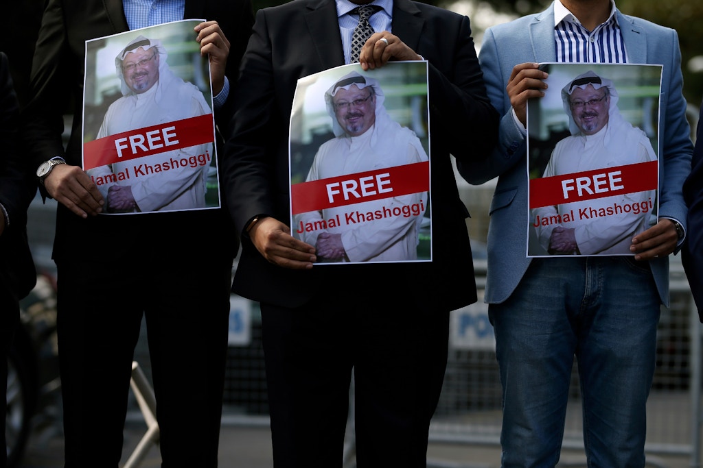 Holding pictures of missing Saudi writer Jamal Khashoggi, people gather in his support, near the Saudi Arabia consulate in Istanbul, Friday, Oct. 5, 2018. Khashoggi, a 59-year-old veteran journalist who has lived in self-imposed exile in the U.S. since Prince Mohammed's rise to power, disappeared Oct. 2 while on a visit to the consulate to get paperwork done to be married to his Turkish fiancee. The Saudi Consulate insists Khashoggi left its building, contradicting Turkish officials who say they believe he is still there. (AP Photo/Emrah Gurel)