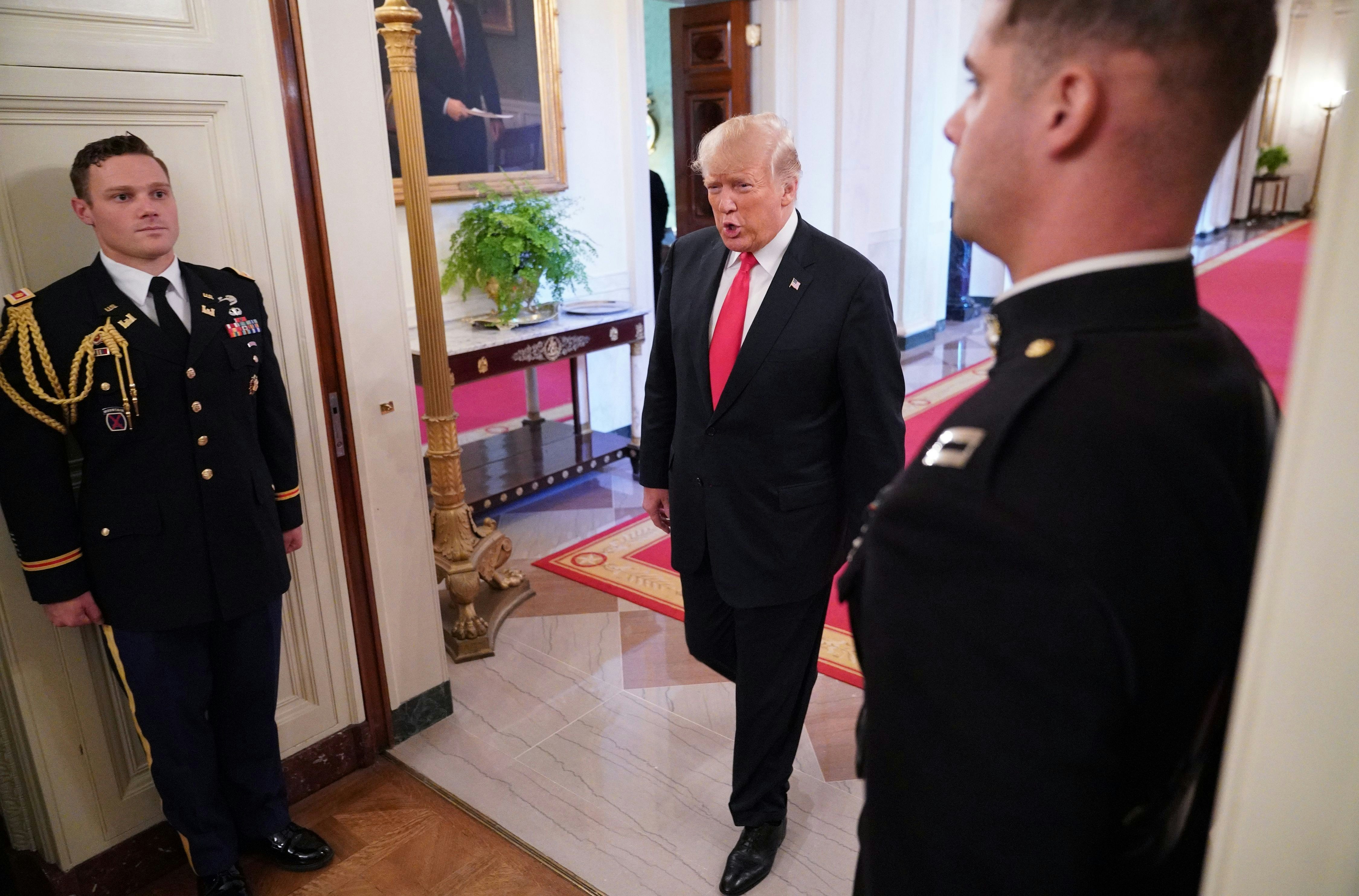 US President Donald Trump arrives for an event honoring the Immigration and Customs Enforcement and Customs and Border Protection services in the East Room of the White House in Washington, DC on August 20, 2018. (Photo by MANDEL NGAN / AFP)        (Photo credit should read MANDEL NGAN/AFP/Getty Images)