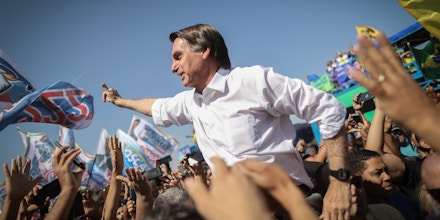 Jair Bolsonaro, presidential candidate for the Social Liberal Party (PSL), waves to supporters during a campaign rally in Taguatinga, Brazil, on Wednesday, Sept. 5, 2018. In polls which exclude former president Luiz Inacio Lula da Silva, Bolsonaro leads the pack ahead of Brazilian elections. Photographer: Andre Coelho/Bloomberg via Getty Images