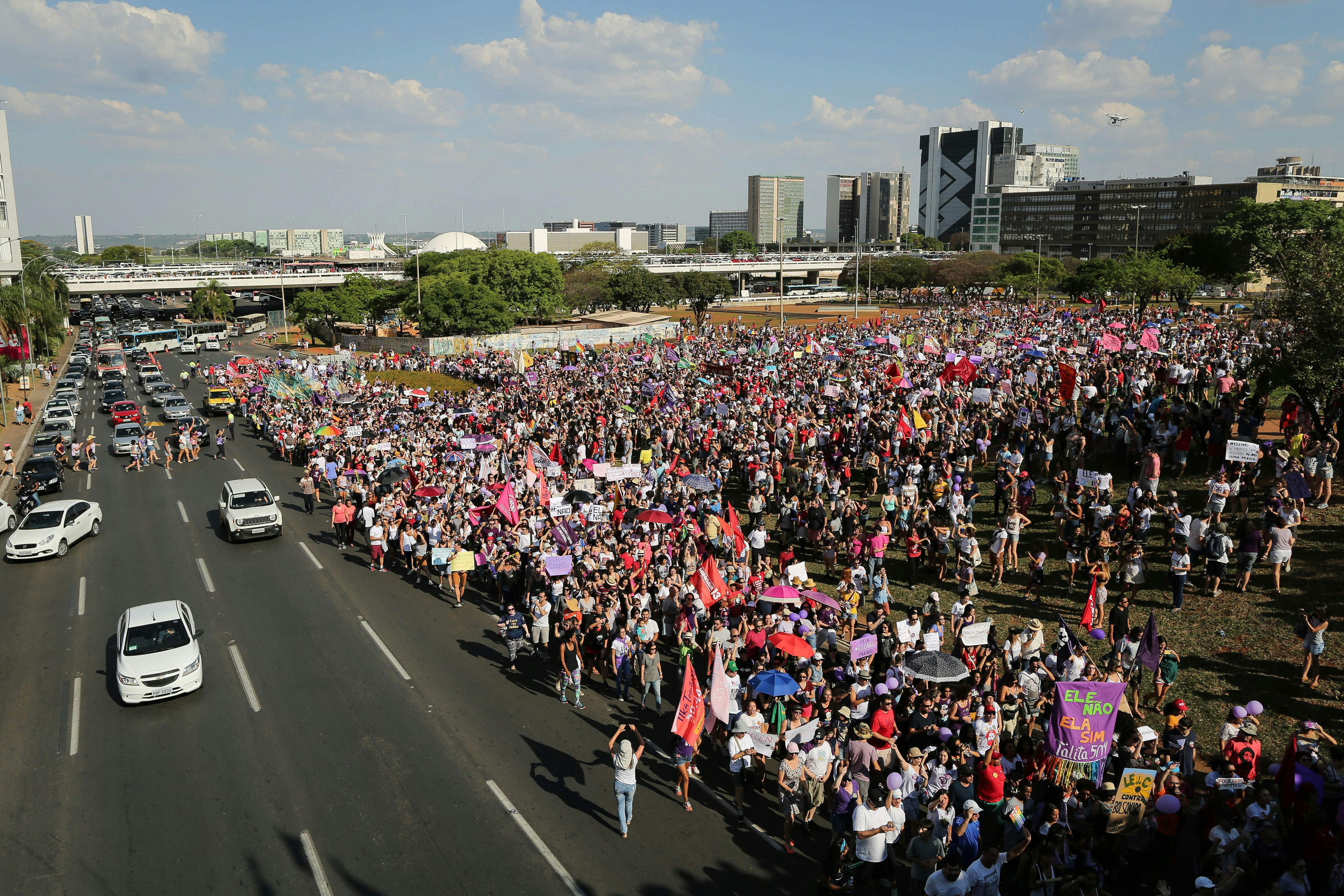 Demonstrators take part in a protest against Brazilian right-wing presidential candidate Jair Bolsonaro, called by a social media campaign under the hashtag #EleNao (Not Him), in Brasilia on September 29, 2018. - Women across Brazil launched a wave of nationwide protests on Saturday against the candidacy of the right-wing frontrunner in next week's presidential elections, Jair Bolsonaro who has been branded racist, misogynist and homophobic. (Photo by Sergio LIMA / AFP)