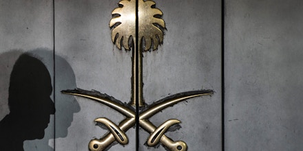 TOPSHOT - The shadow of a security guard is seen on the entrance door of the Saudi Arabia's consulate in Istanbul, on October 12, 2018. - A Saudi delegation has arrived in Turkey for talks on missing journalist Jamal Khashoggi, officials said on October 12, with Riyadh and Ankara sharply at odds over how he disappeared last week from the kingdom's Istanbul consulate. (Photo by Yasin AKGUL / AFP)        (Photo credit should read YASIN AKGUL/AFP/Getty Images)