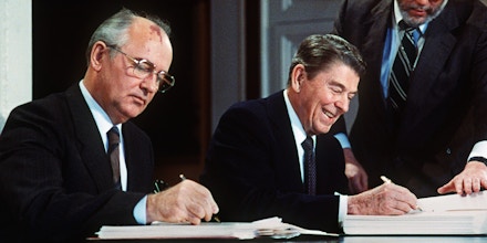 Soviet leader Mikhail Gorbatchev (L) and US President Ronald Reagan sign 08 December 1987 at the Washington summit a treaty eliminating US and Soviet intermediate-range and shorter-range nuke missiles.   AFP PHOTO / AFP / -        (Photo credit should read -/AFP/Getty Images)