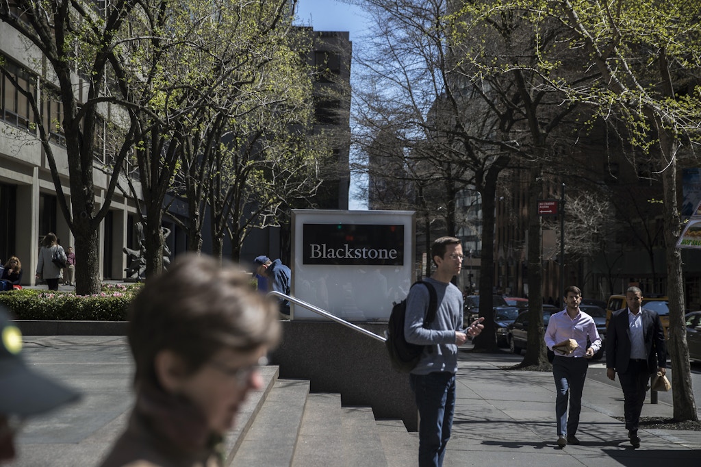 Pedestrians pass in front of Blackstone Group LP headquarters in New York, U.S., on Friday, April 14, 2017. Blackstone Group LP is scheduled to release earnings figures on April 20. Photograph: Victor J. Blue/Bloomberg via Getty Images