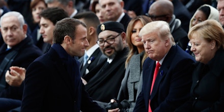 French President Emmanuel Macron (front R) walks past German Chancellor Angela Merkel (R), US President Donald Trump (2nd R), US First Lady Melania Trump (3rd R)  and Morocco's King Mohammed VI (rear C) as they attend a ceremony at the Arc de Triomphe in Paris on November 11, 2018 as part of commemorations marking the 100th anniversary of the 11 November 1918 armistice, ending World War I. (Photo by BENOIT TESSIER / POOL / AFP)        (Photo credit should read BENOIT TESSIER/AFP/Getty Images)