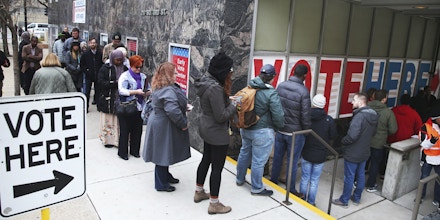 People line up to vote on the last day of early voting at the Minneapolis Early Vote Center Monday, Nov. 5, 2018, in Minneapolis. (AP Photo/Jim Mone)