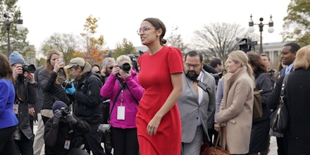 Rep.-elect Alexandria Ocasio-Cortez, D-NY., walks away after a group photo with other members of the freshman class of Congress on Capitol Hill in Washington, Wednesday, Nov. 14, 2018, in Washington. (AP Photo/Pablo Martinez Monsivais)