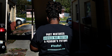 Stefanie Englin looks for her next address while canvassing about amendment 4 in Orlando on Monday, October 29, 2018. In the upcoming election on November 6, Floridians will have the opportunity to vote on Amendment 4, which would give people who have been convicted of a felony the restored right to vote. Credit: Eve Edelheit for The Intercept