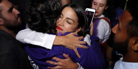 NEW YORK, NY - NOVEMBER 06: Alexandria Ocasio-Cortez hugs a supporter during her victory celebration at La Boom night club in Queens on November 6, 2018 in New York City. With her win against Republican Anthony Pappas, Ocasio-Cortez became the youngest woman elected to Congress.  (Photo by Rick Loomis/Getty Images)