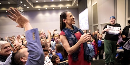 OLATHE, KS - NOVEMBER 06: Democratic candidate for Kansas' 3rd Congressional District Sharice Davids poses for a photo with a crowd of supporters during an election night party on November 6, 2018 in Olathe, Kansas. Davids defeated incumbent Republican Kevin Yoder. (Photo by Whitney Curtis/Getty Images)