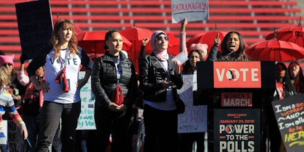 LAS VEGAS, NV - JANUARY 21:  Women's March co-founders (L-R) Bob Bland, Carmen Perez and Linda Sarsour listen as fellow co-founder Tamika Mallory speaks during the Women's March 
