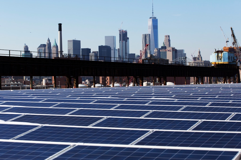 In this Feb. 14, 2017 photo, a rooftop is covered with solar panels at the Brooklyn Navy Yard in New York. The Manhattan skyline is at top. Even if President Donald Trump withdraws U.S. support for the Paris climate change accord, domestic efforts to battle global warming will continue. Dozens of states and many cities have policies intended to reduce emissions of greenhouses gases and deal with the effects of rising temperatures. Even in red states, many consider flood prevention and renewable energy are considered smart business. (AP Photo/Mark Lennihan)