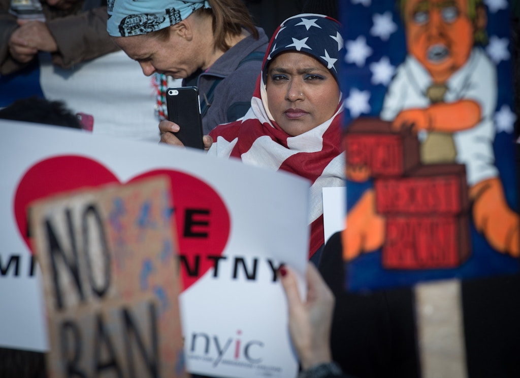 TOPSHOT - Protesters gather in Battery Park and march to the offices of Customs and Border Patrol in Manhattan to protest President Trump's Executive order imposing controls on travelers from Iran, Iraq, Libya, Somalia, Sudan, Syria and Yemen, January 29, 2017 in New York. / AFP / Bryan R. Smith        (Photo credit should read BRYAN R. SMITH/AFP/Getty Images)