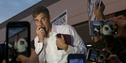 U.S. Senate candidate Beto O'Rourke talks to a group of supporters and early voters at the River Oaks Plaza parking lot Monday, Oct. 22, 2018, in Houston. (Godofredo A. Vasquez/Houston Chronicle via AP)